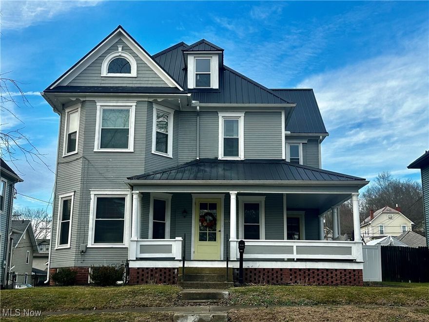 Charming and beautifully updated, this 4-bedroom, 2-full bath home features a welcoming wraparound porch and timeless architectural details. Additionally, it offers gorgeous wood floors, two decorative fireplaces, and classic built-ins that showcase the home's original character. Remodeled in 2020, the home blends historic charm with modern convenience, including a first-floor laundry and a functional, spacious layout. Outside, you can enjoy a level, fully fenced backyard with newer vinyl privacy fencing - perfect for entertaining, relaxing, or your pets. An oversized two-car detached garage with alley access provides ample parking and storage. Find additional storage in the attic or the potential to have it finished for extra living space. You'll have peace of mind knowing there is a durable metal roof, a new hot water heater, and all appliances remain. Blending historic elegance and modern updates, this gem is ready to welcome you HOME!
