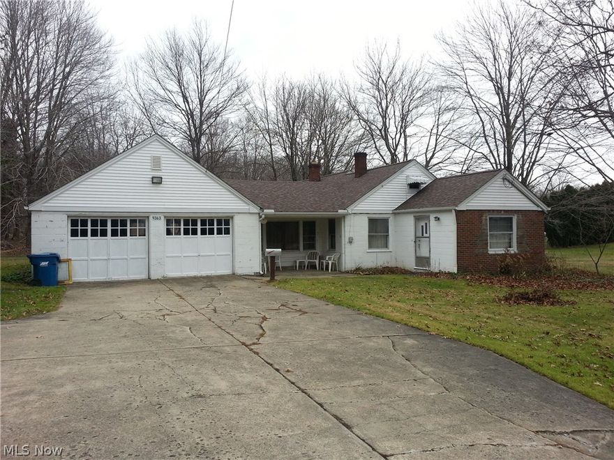 Wonderful with 2.59 acres - Large living room with french doors to sun room, stone fireplace, and front sitting room. Small kitchen but room to extend, formal dining room. Bedroom with private bath. Gas, sewer, and water all available at street. Furnace is convertible to gas. Wonderful location, Poland address, Beaver TWP, and Boardman Schools.