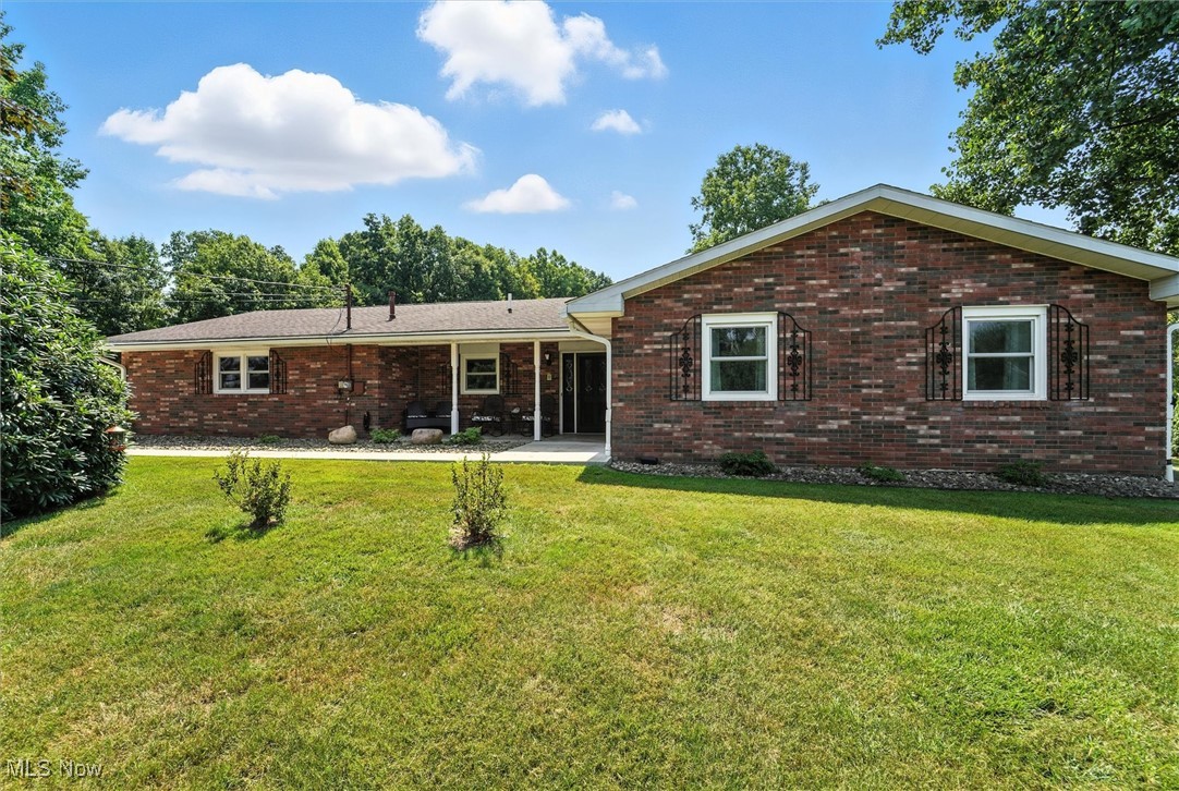 Exquisite 3 bedroom ranch poised with executive detailing in every aspect of this home. Entering into this property will immediately welcome you with beautiful updated flooring, warm inviting color palette is expertly woven throughout the home for perfect symmetry. Attention to detail was precise in every room offering an open concept but still establishing clear division of space. The opulence of the master bath rivals any high-end luxury spa. From marbled tile to custom built cabinetry, you are sure to be pampered. Custom oak cabinetry, tile backsplash, granite counters and Kitchenaid appliances will make any chef swell with pride in creating award winning dishes within this kitchen. If the home isn't enough for you to change addresses then perhaps the expansive outbuilding will do the trick. The property backs to 58 acres of protected ODNR land, offering unparalleled privacy and direct access to outdoor recreation. Well-established trails wind through stunning hemlock forests and connect to the Ashtabula River, renowned for excellent steelhead and smallmouth bass fishing. This rare combination of immediate natural access and permanent conservation protection could possibly ensure your investment is safeguarded from future development while providing a true outdoor lifestyle right at your doorstep.