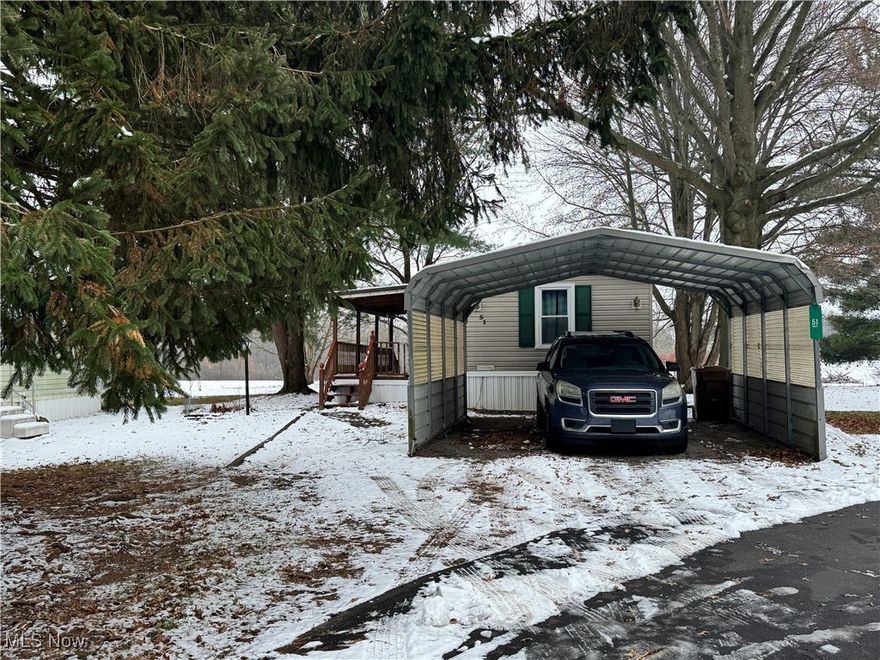 Offering 3 bedroom, 2 bathroom home with a few bonuses including: Washer, Dryer, Stove, Fridge, Microwave, Battery Lawnmower, Battery Leaf Blower as well as the propane generator and the storage shed.  The new buyer could purchase the home fully furnished as well.  Let’s start with the carport that leads to the cozy front porch that opens to the living room.  The living room flows to the dining and galley style kitchen.  Laundry with the back door access.  Owners retreat featuring built in cabinet, full bathroom and walk-in closet.  Home has a zoned layout with 2 additional bedrooms and full bathroom.  Location is great with the view of the farm field.  Home has updated windows, gutter guards and skirting.  Previous owner also added mesh around the skirting as extra protection.  Park community is 55+.  All applicants must complete application with Spruce Tree Village MHP, LLC Application.  Also on their website is a list of rules and regulations. Monthly Lot rent of $370 that does include trash.  The park will also bill for sewer and water.