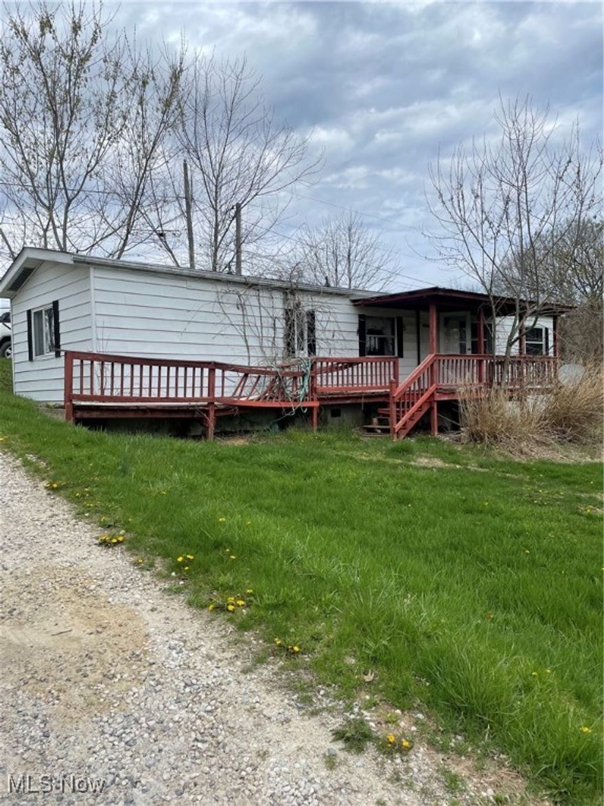 Discover the potential of this versatile 3-lot property, featuring a mobile home that offers an excellent renovation opportunity. Nestled in a serene and quiet environment at the end of the street, this property provides ample room for your vision to come to life. The property also features another mobile home that could be fixed up into another home while also sitting on its own parcel! Don't miss your chance at this opportunity, schedule your showing today! Property being sold in AS-Is condition.