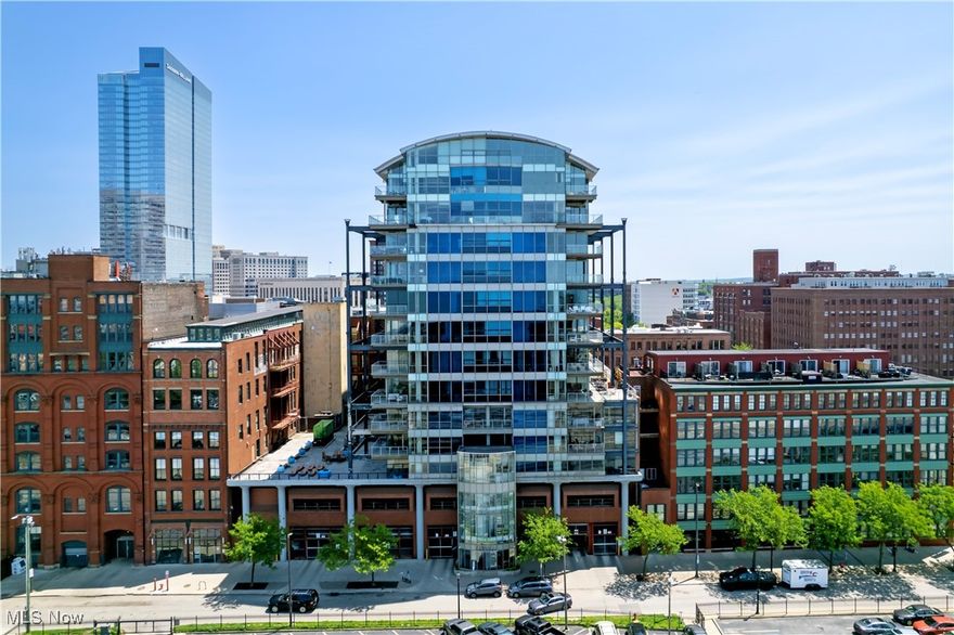Prepare to fall in love with this remarkable 10th-floor corner unit located in one of downtown Cleveland’s most prestigious luxury condo buildings. Perfectly positioned with a northeast-facing orientation, this home offers breathtaking panoramic views of both the dynamic city skyline and the sweeping shoreline of Lake Erie. From sunrise over the city to sunsets dancing across the water, the wrap-around balcony provides front-row seats to the best of Cleveland, including prime views of the annual air show and 4th of July fireworks.  This beautifully appointed residence offers 3 spacious bedrooms, 2 full bathrooms, and a stylish half bath. The kitchen and baths showcase elegant marble and granite countertops, high-end Wolf and Bosch appliances, and a temperature-controlled wine fridge, ideal for entertaining or quiet evenings at home. The open concept main living area is flooded with natural light thanks to floor-to-ceiling windows, all adorned with remote controlled blinds for effortless privacy. A gas fireplace adds warmth and charm during Cleveland’s colder months, while the primary suite pampers with heated floors and a spa inspired steam shower.
Additional highlights include hardwood floors, a Cleveland skyline mural hand-painted by a local artist and sophisticated finishes throughout the unit. The building itself offers an exceptional array of amenities: a serene common terrace with a fire pit and grills, state-of-the-art fitness center with lake views, yoga room, 24/7 security, and twice-yearly professional window cleaning. Two deeded parking spaces are included and conveniently located. Best of all, this prime location puts you within walking distance of Cleveland’s top destinations, lakefront parks, professional sports venues, the Rock and Roll Hall of Fame, Playhouse Square, the central business district, dining, and so much more.  Don’t miss your chance to live in the heart of it all.  Luxury, lifestyle, and location await at 701 W Lakeside Ave, Apt 1001.