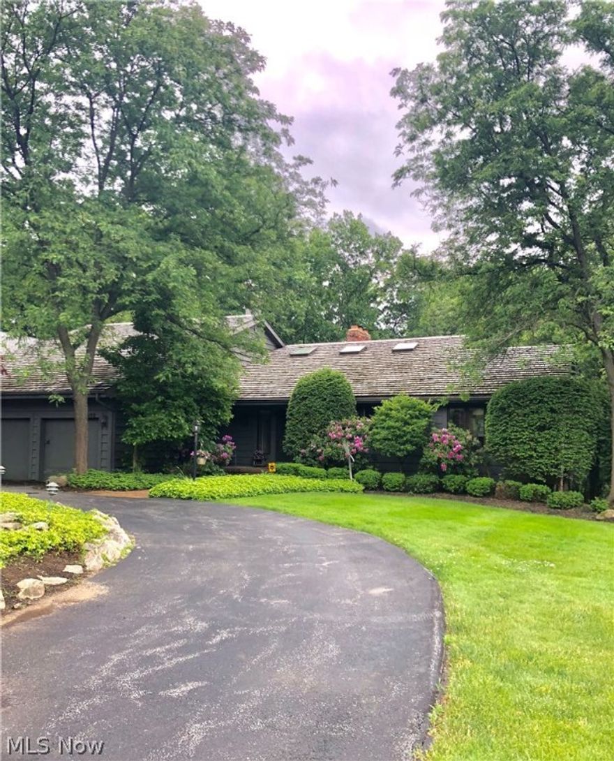 Sprawling cedar sided Contemporary with soaring ceilings and an open 3-level floor plan with hardwoods throughout. You will enter the home off the circular driveway which leads you to a spacious foyer. A grand and cozy family room welcomes you with vaulted ceilings and fireplace overlooking the pool. Updated cook’s kitchen with island/breakfast bar flows effortlessly with the formal dining room and family room to optimize entertaining as well as day to day living. Master Bedroom on first floor with massive walk in closet and master bathroom en-suite flanks the 1st floor office/den. You’ll find a large bedroom suite on 2nd floor has 2 walk-in closets and full bath. The laundry/mudroom with built-ins and half bath are also on 1st floor off the 3 car garage. 

The lower level boasts a 2nd full kitchen, 2nd family room, recreation room, 2 bedrooms, 2 full baths, an amazing amount of storage and walks out to a covered patio, pool and lush landscaped, fully fenced yard. An expansive 2 story deck connects the main floor and lower level, outside. 

And the list goes on and on! This is only a hint of this very special home. Must see!!