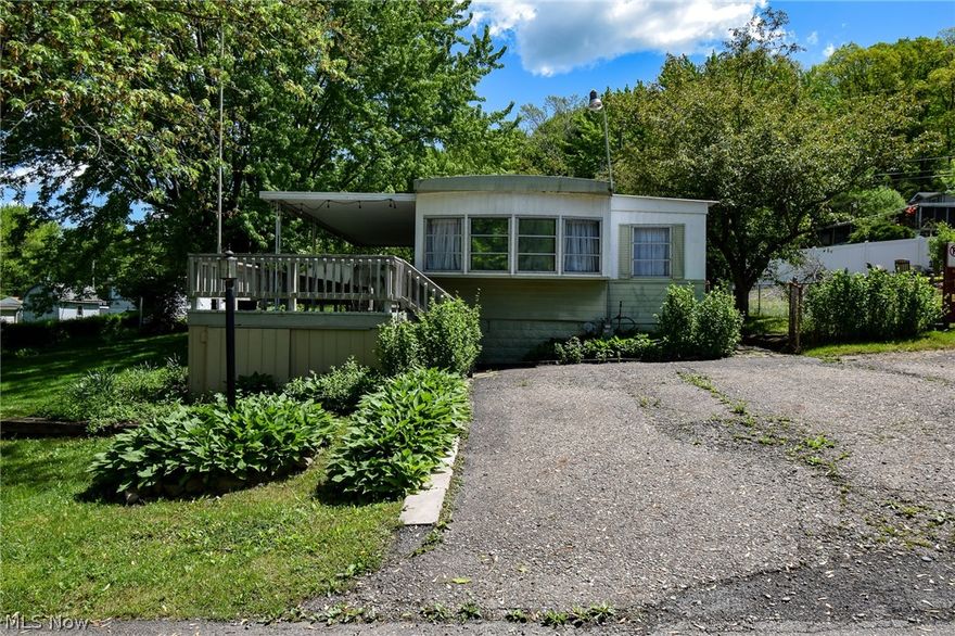 ONLINE ONLY AUCTION!! Online Only Auctions starts ending Monday June 17th @ 6:00 PM.  Discover your next getaway nestled near the serene shores of Atwood Lake. This 3-bedroom, 1-bath modular home is perfect for your next getaway and could also be a permanent residence. The home has an open concept kitchen, living room, 1st floor laundry and a porch attached to the modular home on the outside. The property also has a shed for all your storage needs and is within walking distance of the lake to your boat dock. Utilities to the home include a shared water well, public sewer, gas furnace and central air. Don't miss this great opportunity to own a property close to Atwood Lake with a boat dock.