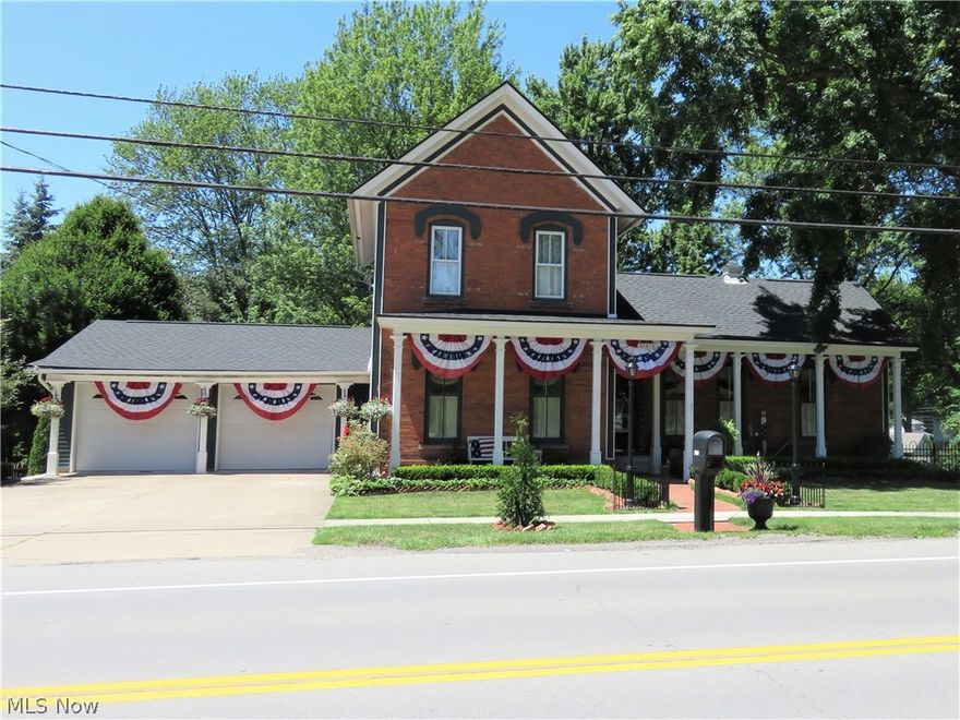 Welcome to this gracious historic brick charmer situated in the heart of Avon's French Creek district!  Exuding pride of ownership and attention to every detail, this one of a kind beauty is without a doubt one of the most remarkable century homes in Avon, and it has been beautifully updated to offer a comfortable mix of modern amenities coupled with all the workmanship and charm you would expect.  Nestled on nearly an acre of stunning landscaping, perennial beds, and terraced patios, the back yard is a private oasis, fabulous for outdoor entertaining.  Custom outbuilding offers plenty of storage space for your mower, patio furniture and garden implements.  The brick walkway and inviting front porch welcomes you to step inside the impressive foyer, flanked by the oversized living room with gorgeous wide planked floors and decorative fireplace.  The gathering room of the home is the beautifully updated kiitchen with an abundance of white cabinetry, expansiive counter space and new high-end stainless appliances (May 2024).  There's room for all in the spacious hearthroom, dining by the fireplace while enjoying panoramic views of the parklike backyard. Two bedrooms are on the main floor, one being a generous primary suite with full bath, as well as another room which includes a large clothing armoire.  Upstairs is a second owners suite with full bath and an adjoining tandem room, ideal as a large dressing room, or easily transformed into a dream walk-in closet.  The lower level is the finished basement comprised of a spacious family room, a 4th bedroom, a 3rd full bath and laundry room.  This level walks out to a 3-season room and the wonderful backyard terrace.  This remarkable home has never before been listed for sale;  this is your opportunity to own a piece of Avon's rich history!