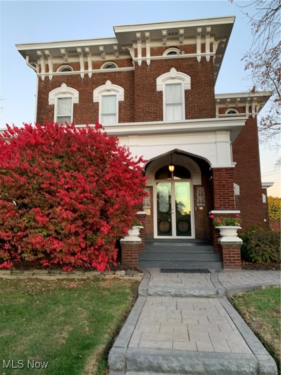 National Register of Historic Places by the United States Department of the Interior. This extraordinary historic home located on a 3/4 acre lot in a residential setting, this incredible historic home showcases 150-year old floors and an impressive collection of woodwork, including rich mahogany, chestnut, and walnut. The front foyer entry is exquisite with original ornate mahogany winding staircase, offers a warm and inviting welcome. The “Haman Bordner House” is a 2 1/2-story brick residence in the High Victorian Italianate style. Elements of the style reflected in this house include segmental arch 1/1 windows with hood molds, prominent paired roof brackents, semi-circular frieze windows, and a low-pitched hip roof. A sandstone molding over the entryway transom bears the date, “1880", and the names, "Haman Bordner and Lidia Bordner.” The prominent porch is a later addition to the house. Home has 5 bedrooms, 3 bathrooms, parlour, original refinished flooring throughout most of the home, 3 original chandeliers, 5 original room light fixtures, original cabinet from floor to ceiling on main floor and one on second floor. The parlour features original draperies sourced from the renowned Palace Theatre, adding a touch of vintage elegance. The exterior features several gardens bursting with vibrant blooms throughout the spring, summer, and fall, creating a stunning display that surrounds the home. The current owner has overseen extensive upgrades and renovations throughout the home, thoughtfully preserving its integrity and historic charm while honouring its original character. A complete list of upgrades and renovations are attached as a supplement.