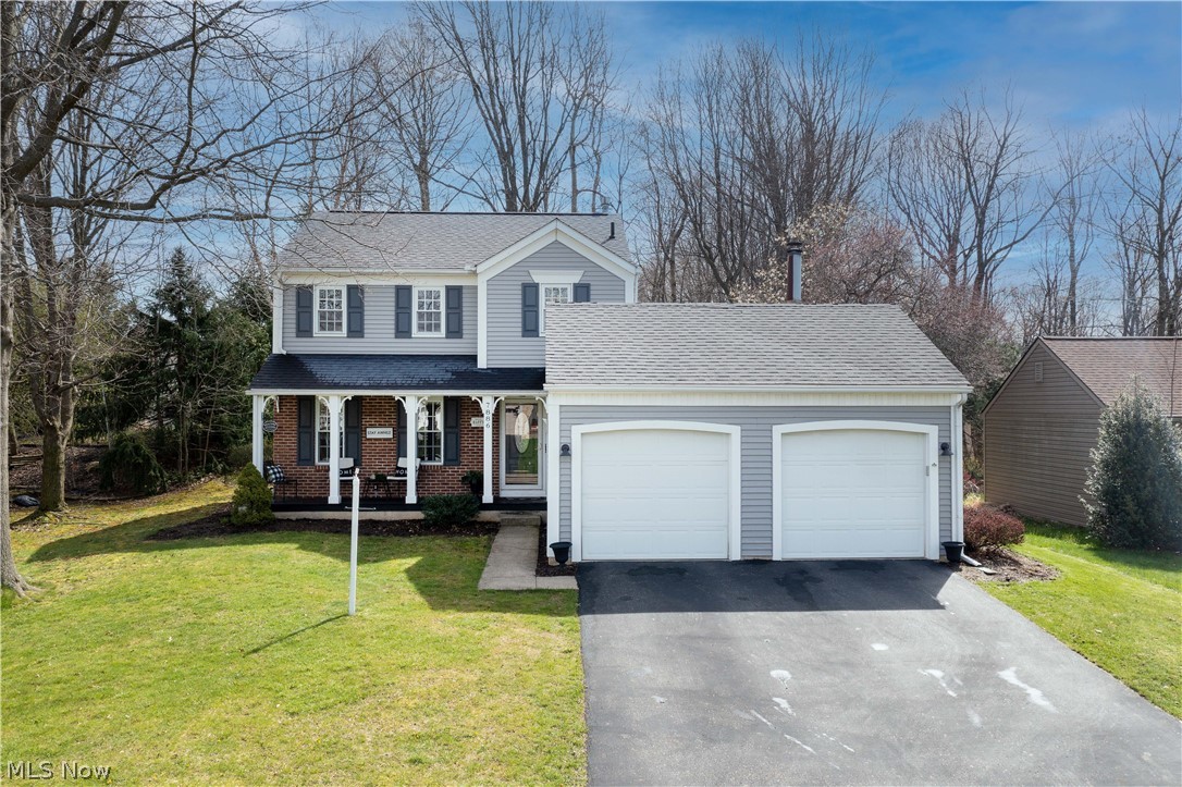 This home is beautifully maintained and easy to fall in love with, located in the excellent-rated North Canton CSD. An inviting front porch welcomes you to this lovely Colonial home with approximately 2,054 Sq Ft of living space. Beautifully decorated, the great room has crown molding and an archway to the formal dining room. The Updated eat-in kitchen offers white cabinets, tiled backsplash, appliances, a center island, and gorgeous accent walls. Enjoy the cozy/charming family room with a vaulted ceiling, shiplap accent wall, a wood-burning fireplace, and sliding glass doors that lead to a lovely deck with a privacy fence and a backyard with a firepit. Upstairs is the Master Suite with a spacious private bath with built-in makeup vanity. Two additional bedrooms and a full bath complete the 2nd floor. Downstairs finished basement with a recreation room, glass block windows, a laundry area, and plenty of storage space. Convenient 1st-floor 1/2 bath and attached 2-car garage. Close to sh