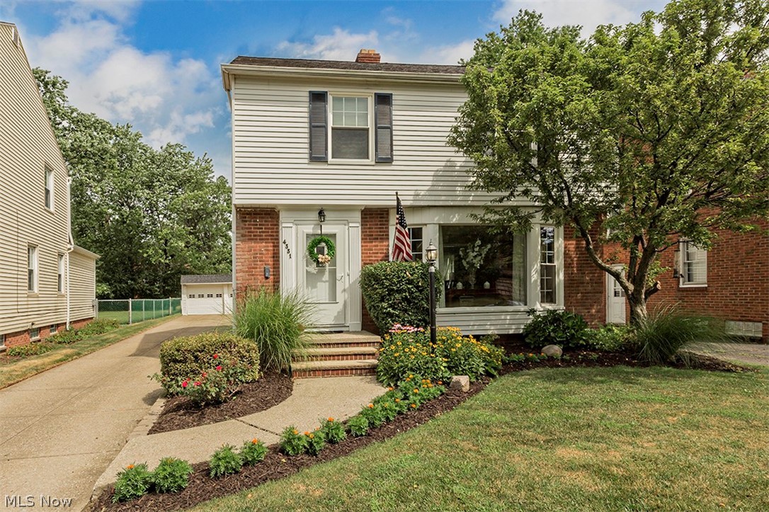 Absolutely pristine 4bd/1.1 bth colonial in beautiful University Hts. Formal living and dining room w/ gorgeous hardwood floors and woodburning fireplace. Cute eat-in kitchen offers great storage, eat-in nook and lots of natural light. Large bonus family room spills out via new sliding doors onto patio and overlooking the oversized backyard! Updated half bath on main floor. The gorgeous hardwood floors continues in the 3 main bedrooms, including the master suite on second floor, all while sharing a full main hall bath. Recently finished 3rd floor offers another bedroom or bonus space for todays families. Finished lower level rec room w/ laundry area/workshop area & storage is an added bonus to this fabulous house. Newer landscaping and ALL new windows in the home adds tremendous value on this sought after street! Detached 2 car garage and a great backyard, larger than your typical Univ Hts. home. A must see!