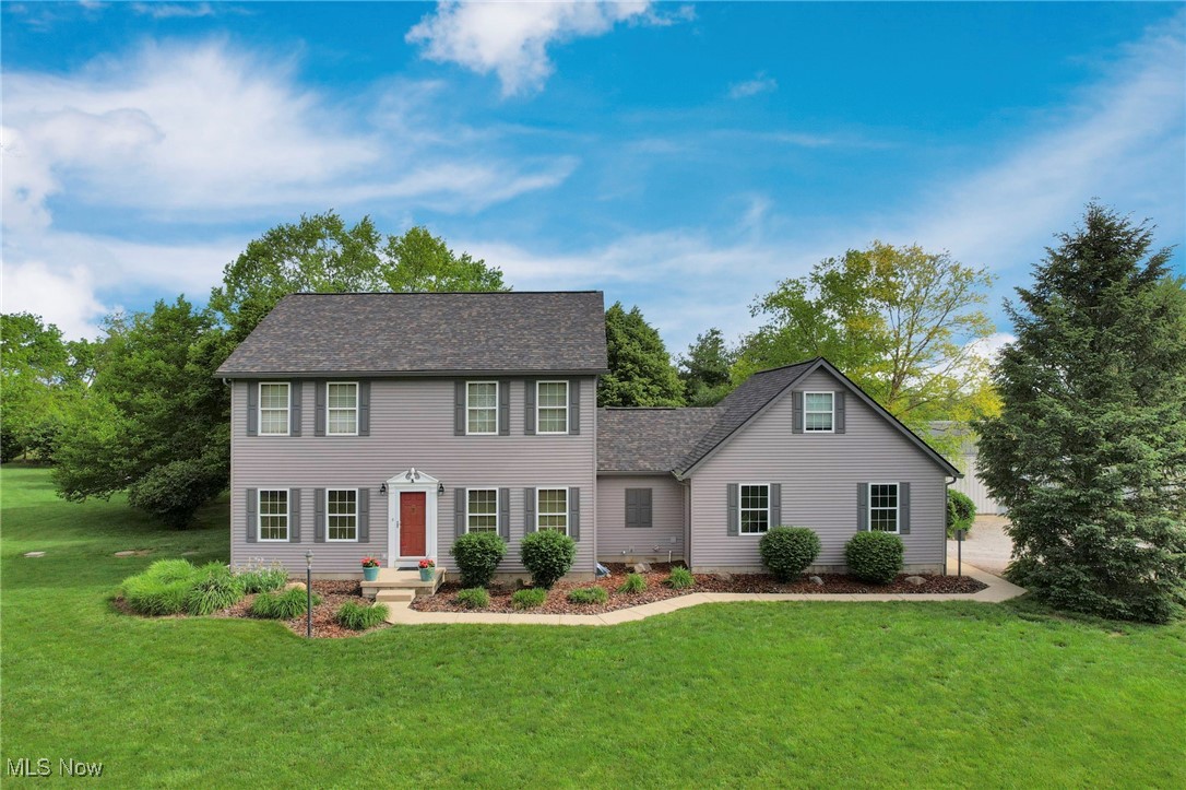Stop scrolling - you just found your dream home! Nestled on a peaceful 2-acre lot in the highly sought-after Canal Winchester Local School District, this meticulously maintained Colonial-style home offers the perfect blend of space, comfort, and functionality. With 4 spacious bedrooms—and a possible 5th—plus 3 full bathrooms, this home features flexible living areas ideal for today's lifestyle, including a dedicated home office and a generous bonus / flex room. Gorgeous hardwood floors flow throughout the main level, which also offers a convenient first-floor laundry room, formal dining, living room with gas fireplace, and a fully applianced kitchen ready for entertaining. Step outside to enjoy the covered back patio, perfect for morning coffee or relaxing evenings adjacent to a peaceful large backyard. Home also includes a 2-car oversized attached garage. The true standout of the property is the impressive 1,700 square foot outbuilding and additional garage, equipped with electric, a wood stove, and a mini split system for year-round heating and cooling—perfect for a workshop, studio, or hobby space. Recent updates include a newer roof and siding, offering peace of mind and great curb appeal. Don't miss this rare opportunity to enjoy country living with modern amenities, all within minutes of town conveniences.