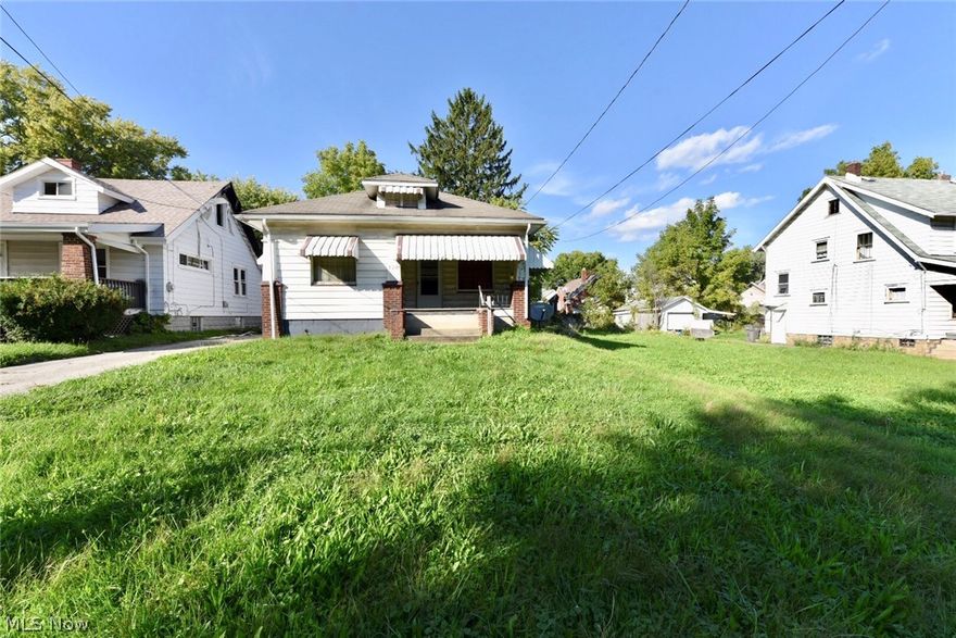 Lots of potential in this cozy bungalow home. The spacious living room offers plenty of natural light and has loads of character with fireplace and built-ins. Hardwood floors throughout most of the property. Large eat-in kitchen. There are two bedrooms and a bonus room that can be used as a den or office. Two car detached garage. Sold As-Is. Buyer to do their own due diligence.
