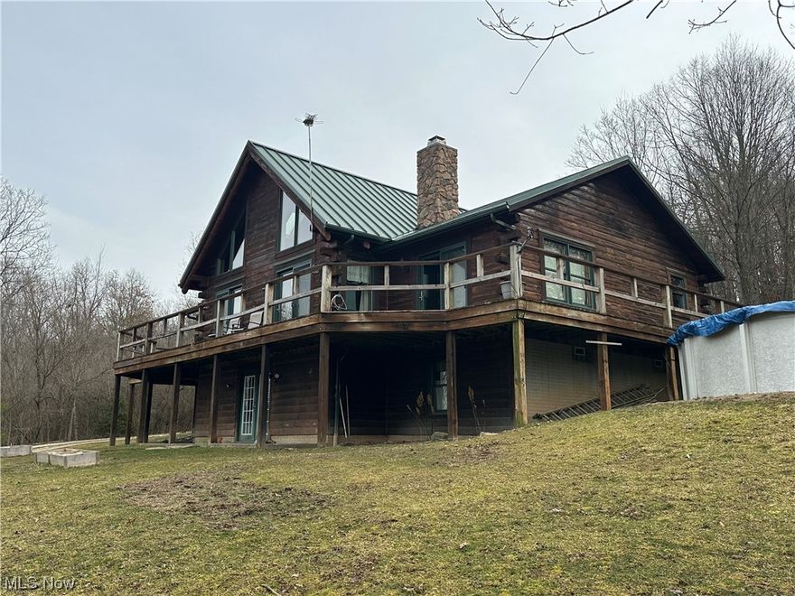 A beautiful custom log home situated on 14+ acres just minutes from Salt Fork State Park. This rustic lodge-style home boasts 3 bedrooms and 3 full baths, a 2nd story loft, a vaulted log ceiling and plenty of natural light. The double-sided stone wood burning fireplace is accessible from both the Owner’s Suite and the living room. The kitchen is equipped with stainless steel appliances and a center island with wine fridge. The walk-out basement offers the possibilities for more living space or storage.  The property is partially wooded with a large hay field and an abundance of deer, turkey and small game. Relax on the large wrap-around deck that offers sunset views and an above ground pool to cool off on those warm days.  A 32 X 48 pole barn with a paddock and 12 x 12 lean-to for horses or livestock, can easily be converted to workshop or storage.