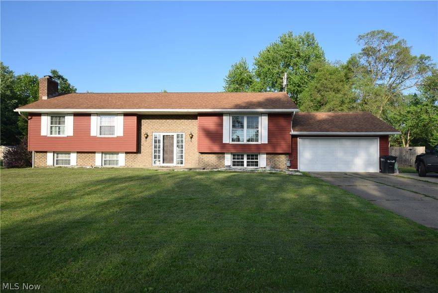 Welcome to this beautiful 4 bedroom bi-level home situated one over a half acre lot in Marlington Local School District.  Situated on a double lot this home features a 2 car attached garage.  As you enter through the garage into the lower level mud room/laundry room you can comfortably kick off your shoes and hang your jacket in one of the large closets.  You will find one bedroom on the lower level along with a half bath and a massive family room.  Family room has a beautiful wood burning brick fireplace.  Head on upstairs where you will find the remaining three bedrooms, living room, dining room, and kitchen. Off the dining room you'll walk through the sliding glass door onto the deck that overlooks the in-ground swimming pool and patio area.  If you are an entertainer this will be the most popular spot all summer long. Back yard is fully fenced in to keep your furry friends safe as well. Head back inside and down the hallway to the master bedroom which has a large master bathroom with stand up shower and jacuzzi tub.  It also features a double vanity.  Walk in closet finishes off the Master.  Many many updates throughout this home including HWT, Furnace/AC, Flooring, Roof, Siding, and so much more.