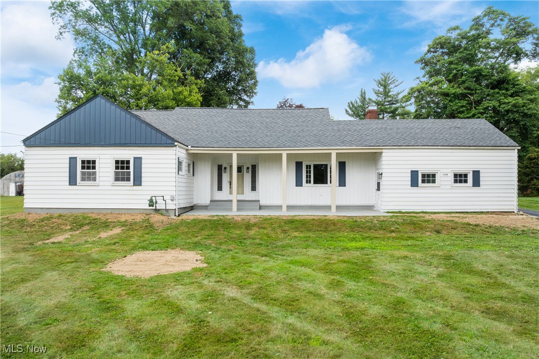 Welcome to this beautifully renovated 3-bedroom, 2-bath ranch nestled on a private 1-acre lot in North Lawrence, backing up to Hole 5 of the Elms Country Club. Located in the highly sought-after Tuslaw School District, this stunning home blends modern upgrades with peaceful rural charm. Providing over 2200 square feet of living space, this charming home has so much to offer. Step inside to an extra-wide, impressive foyer that sets the tone for the spacious layout. The home features a gorgeous brand-new kitchen with quartz countertops, soft-close custom cabinetry, pantry, and all new appliances, flowing into a formal dining room—perfect for entertaining. The large living room boasts a striking stone fireplace and ample natural light. The spacious primary suite includes a generous closet and a brand new ensuite bath. Two additional well-sized bedrooms and a second full bath offer comfort and flexibility. The newly finished basement adds a large rec room with new glass block windows that let in natural daylight, providing extra space for relaxing or entertaining. Additionally, the lower level provides a nicely sized laundry area and plenty of storage space. Major 2025 upgrades include: New roof, windows and doors, A/C, septic system, sump pump, flooring throughout the entire home, fresh paint throughout, all new interior and exterior lighting, new garage doors, and so much more. Top to bottom, it has been fully renovated with pride. This home is move-in ready and offers the perfect balance of privacy, modern style, and a prime location. Whether you’re enjoying the serene backyard views of the golf course or exploring the surrounding countryside, you’ll love calling this place home! Don’t miss this rare opportunity—schedule your showing today!