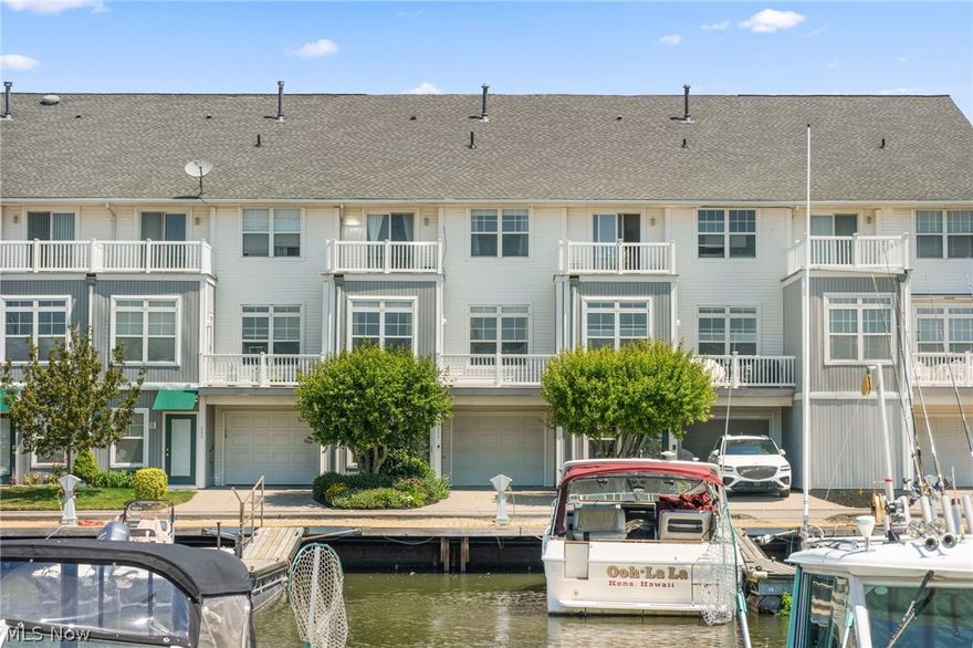 Welcome to this 2 bed, 2.5 bath townhouse located in the Black River Landings Harbor Walk in Lorain. The prime location of this home allows owners to step outside of their front door and be greeted with a beautiful view of the Black River and they can enjoy the events of the Rockin' on the River summer concert events. The townhouse is also just a short drive away from local stores and restaurants. Owners can enjoy amenities such as access to the clubhouse, pool, and fitness center. Step inside and be welcomed by the open-concept layout of the main floor that allows the living room and eat-in kitchen to flow effortlessly together. The living room has beautiful hardwood floors, large windows that allow natural light to fill the area, and access to the raised balcony. The eat-in kitchen has stainless steel appliances and a space large enough to fit a breakfast table. The kitchen area is also where you can find the laundry closet. Both bedrooms have carpeted flooring, vaulted ceilings, and large closets. One of the two bedrooms has a private balcony that is the perfect spot to enjoy a warm summer morning with a beverage. Both of the full bathrooms have single-sink vanities and convenient shower/tub combos. This home also has an attached 1 car garage. Some notable updates to the home include a new roof in 2023. The boat slips are owned by Spitzer Marina and can be rented out. Don't miss out on this opportunity and schedule your private showing today!