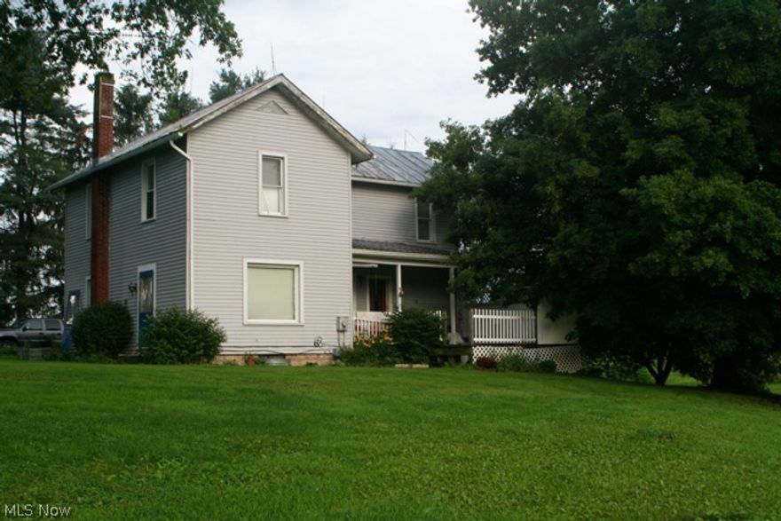 Classically charming 4 bedrooms, 2 bath farm home on 10.4 Acres. Home has updates and is located in the middle of the land which provides much seclusion and tranquility. Large bank barn has been sided. Detached barn could easily hold 4+ cars. Two (2) entrances to property.Park like setting.  Perfect for horses and other small farming operations.