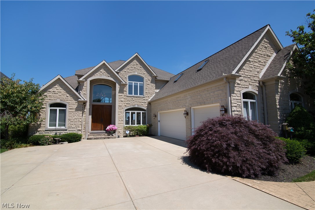 This breathtaking Lakefront Property sits on .44 acres with unobstructed lake views and direct lake access. This stunning home was built by DiBenedetto Fine Homes. This is the perfect home with 6 bedrooms, 5 1/2 bathrooms and 3 car garage. Enjoy the walkout basement down to your own private Tiki Bar, where you can enjoy year-round sunsets. The FIRST FLOOR features a Master Suite with limestone throughout the bathroom, large walk-in closet, 2 Story Foyer, 2 Story Great Room, fireplace and custom bookshelves, office, double island, Gourmet Kitchen with top of the line Stainless Steel Appliances and Granite Countertops. The SECOND FLOOR features 4 bedrooms with gorgeous views of the lake and 3 full baths. The WALKOUT BASEMENT is incredible. It features a full kitchen, in-law/guest bedroom with full bath, media room with fireplace, gym, billiards room and a covered porch. The property is secured by a Breakwall and has a sprinkling system for the lawn. THIS IS A MUST SEE HOME!!!