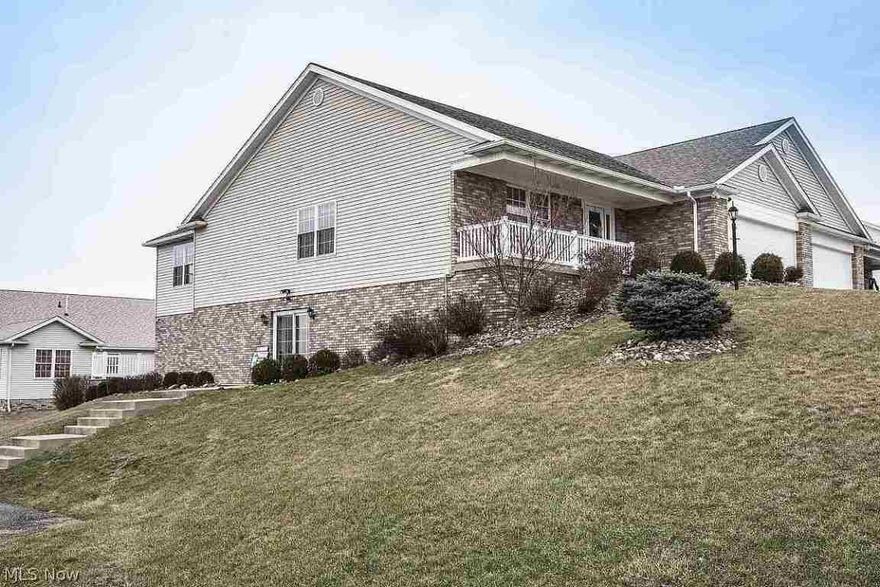 Beautiful 3 bedroom home with a wonderful master bath and two more full baths with tile floors. Upstairs kitchen and dining room has great looking hardwood flooring. Walk into a large tile covered entry way and then into a large carpeted living room. Plenty of window light throughout  this house. It has a lower level with a carpeted 21’10” x 38’ 3” recreation room. The lower level has a large office, a bedroom, second kitchen and second laundry room. It sits on a corner lot and has a great view from the di