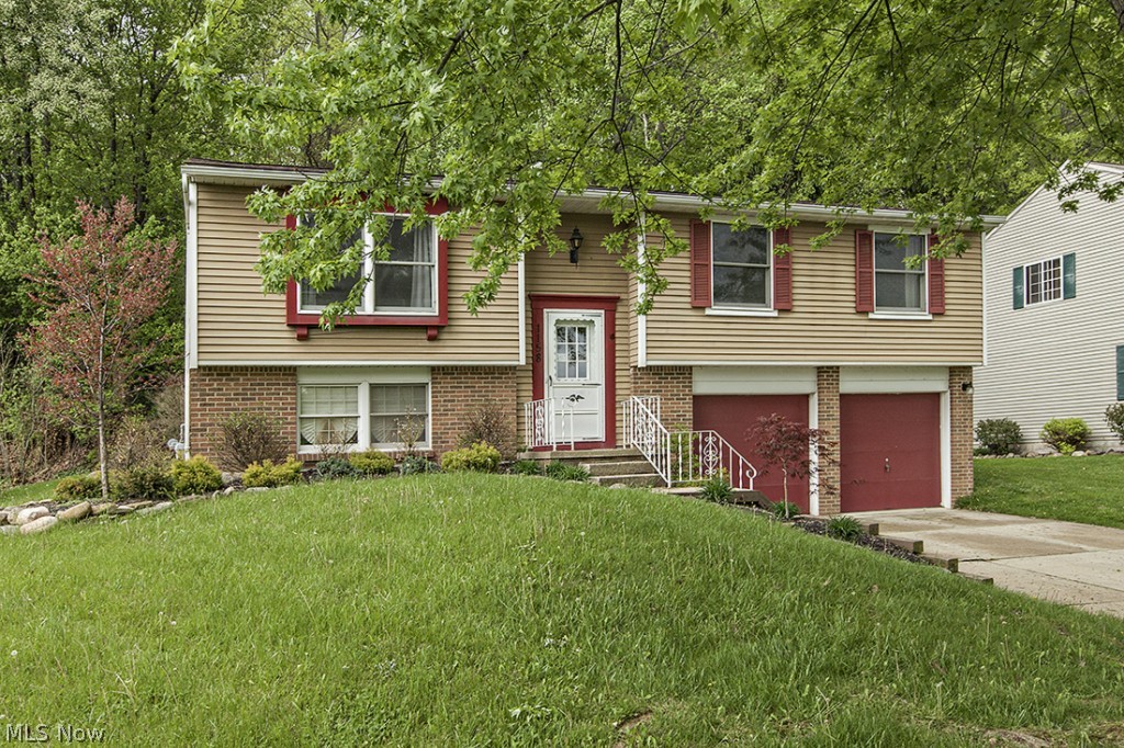 WOW! Come check out this move in ready home. Everything updated ... kitchen boasts granite counters, stainless steel stove and microwave, glass tile backsplash with laminate floors. Whole home is freshly painted with HGTV colors with newer carpeting. Updated 2-1/2 bathrooms. Dining area has sliders to deck with abundance of privacy and woods. The lower level rec room has newer carpet and paint as well featuring a half bath. Furnace/AC replaced in 2010. Laundry on lower level with washer and dryer included. Take Action Now ... this could be yours!!!
