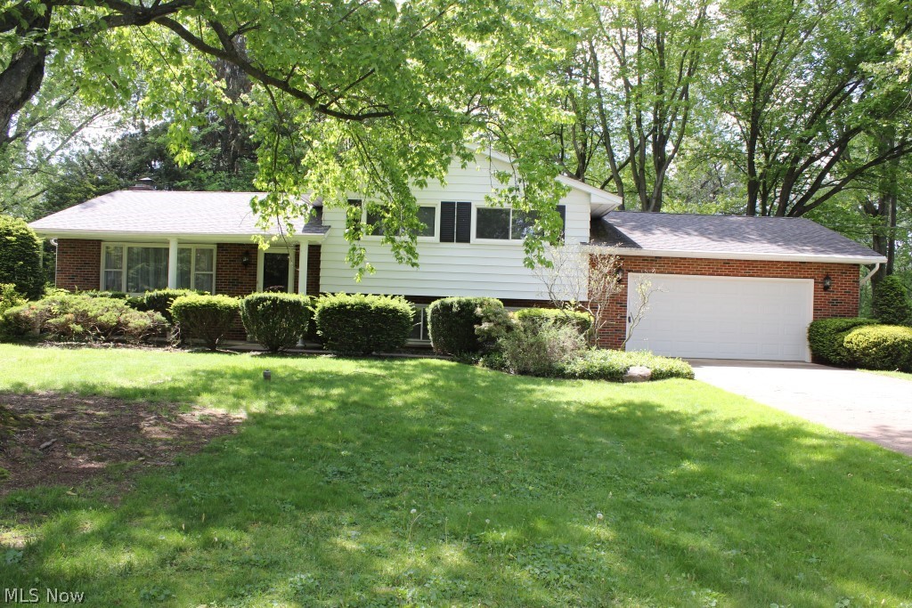 One owner 3 bedroom/2 bath, 3 level split, lovingly cared for & well built with 1684SF situated on .65 acre private level lot* Freshly painted including ceilings, closets & garage* Hardwood floors throughout except kitchen, bathrooms & lower level rec room* Light & bright living room opens to formal dining or family room with gas log wood burning fireplace & slider to 12x16 covered deck* Applianced eat in kitchen (refrigerator, range, dishwasher, disposal)* Master bedroom with bath, laundry chute* 2 additional bedrooms & guest bath with updated sink, commode, light, faucets & floor* Hallway has built in linen cabinet with drawers & attic access* Recreation room with newer carpet & wet bar* Oversized garage approx. 23x23 with hot & cold water (updated faucet), built in cabinets, storage above garage, service door to back yard & updated garage door* Shingles, single layer, approx. 6 yrs.* Updated electrical box* Many updated light fixtures* Central air approx. 2 yrs. * Carrier 92% eff