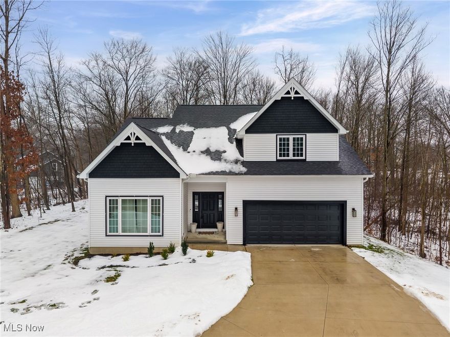 Newer construction in the highly sought-after Solon School District! This custom-quality home offers 4–5 bedrooms and 3 full baths with a flexible, versatile floor plan to fit any lifestyle. The primary bedroom is located upstairs and easily accommodates large furniture, a home office, workout area, and more. It features a vaulted ceiling with ceiling fan and a spa-like en-suite bath with a large custom subway-tile shower, skylight, porcelain tile flooring, high-end granite countertops, dual sinks, walk-in closet, linen storage, and a private commode area.

The spacious kitchen showcases extra-tall custom cabinets (plywood construction with soft-close, dovetail drawers), high-end granite countertops, and a peninsula with bar seating. Luxury vinyl plank flooring flows throughout the first floor and opens seamlessly to the Great Room with vaulted ceiling and ceiling fan—perfect for entertaining. Two additional rooms on the main level feature generous closets and can be used as bedrooms, offices, dens, or additional living space.

Additional highlights include three full baths (including a first-floor en-suite), a dramatic two-story foyer, and a 9’ basement with studs, insulation, and plumbing in place for a future full bath—ready to be finished. Enjoy outdoor living on the private rear patio, plus a 2-car garage, high-efficiency furnace and water tank, 2x6 construction for energy efficiency, and unique handmade light fixtures from Cleveland Art. No HOA! Conveniently located near shopping, schools, freeway access, and more.

Currently the seller is using the downstairs BR as a Master and the other BR on the 1st Flr as a 2nd den.