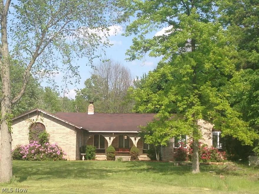 Take me to the country!  Dream Ranch!  Brick and Stone.  Welcoming Front Porch to Watch the World Go By.  Designed for Entertainment or relaxing.  Slate Entrance leads to Step Down Formal Living Room open to Sizable Dining Room.  Eat-in Country Kitchen viewing oversize Great Room with impressive Stone Fireplace, cathedral and beamed ceilings.  Master Bedroom Suite with updated bath with designer double sink.  Wall of closets and private patio.  The basement features two recreation rooms.  Optional media room/game room/2nd family room with fireplace.  Newer furnace.  New laminate/wood/ceramic tile flooring on main living areas.  Attached 2.5 car garage.  Bonus 60x40 pole building-garage (holds approx 4-8 cars/workshop) door, man door, and sliding doors in rear.  Pond!  4-5 bedrooms!