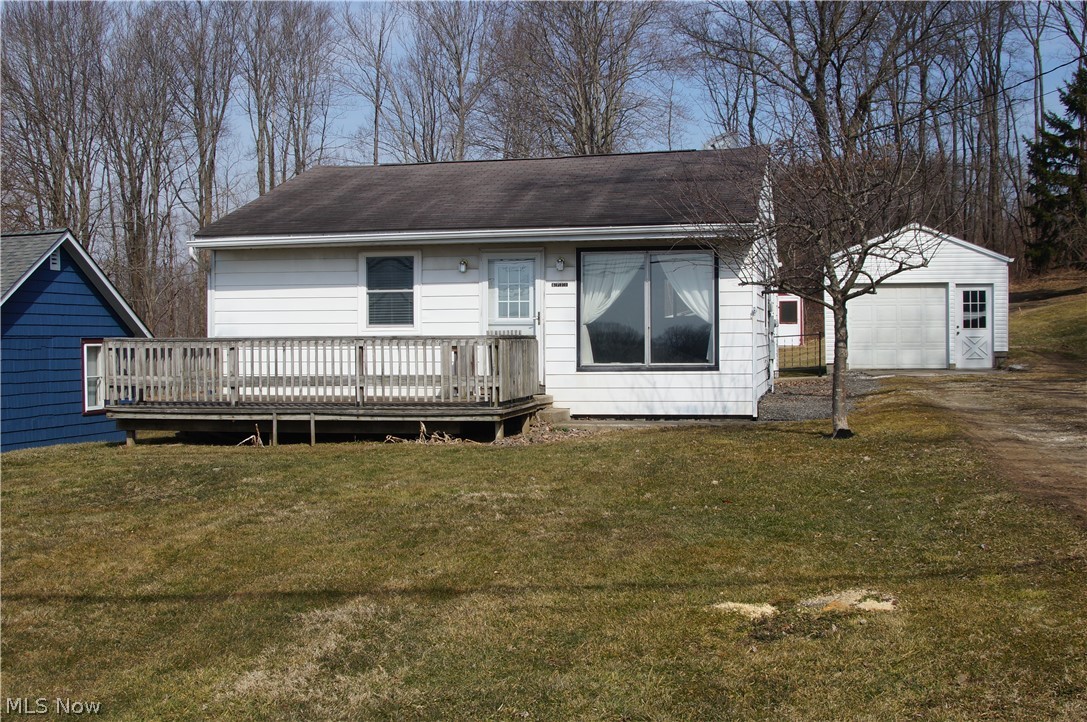 Two Bedroom home on almost an acre with newer windows and doors, outbuilding has garage door and electric Sorry No FHA/VA. Cash or conventional only.