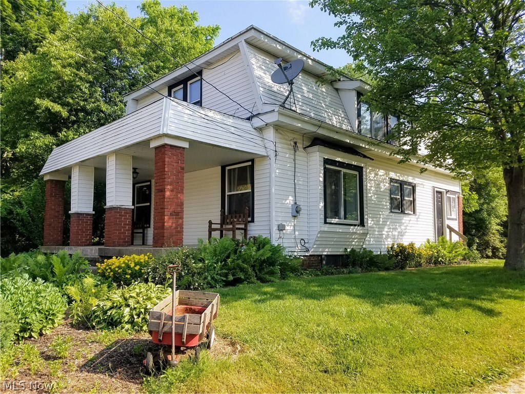 This great home, within walking distance to the square in the quaint little town of Hartville, with a coffee shop, pizza
shop, Hartville Chocolate Factory and much more! This nearly 1700 sq foot home has a beautiful lot with
mature trees and lush landscaping. The large front porch is perfect for relaxing with a tall glass of iced tea and the
generous back yard is just waiting for kids & pets to fill it up. The first floor has a large living room, spacious eat-in
kitchen with appliances, mudroom, half bath and the first of 4 bedrooms. The second story has 3 additional bedrooms,
half bath and lots of closet space. Updates made by current owner since he purchased it include: '03 replaced exterior
doors & installed French drain 1/2 of basement, '05 replaced furnace & A/C, '06 four new windows on 2nd floor, '12 new
water heater, '14 new sump pump, '16 replaced mother board in furnace & A/C motor & condensor, '17 some interior
painting & all trim, replaced bathroom vanity.