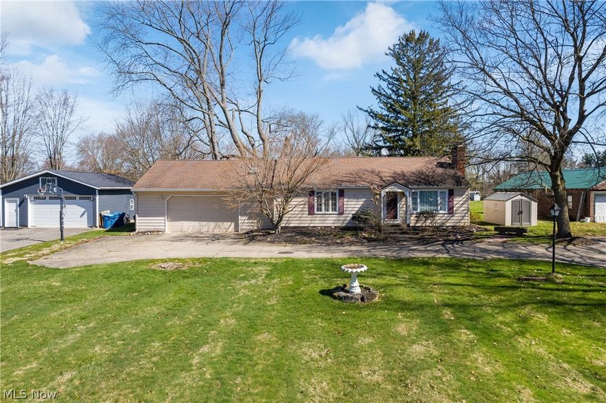 Welcome to this ranch home in Copley Twp! Nestled within walking distance of the vibrant Copley Community Park (80-acres), close to the local favorite Rizzis, & a short drive to Fairlawn shopping! Spend summer enjoying the large backyard, time at the park, & some Rizzis ice cream! This spacious property offers the perfect blend of comfort & convenience.
Step into the bright & airy living room, illuminated by natural & recessed lighting, offering ample space for relaxation & entertainment. The living room leads into a quiet library/study, which then leads to the beautiful and grand kitchen.
Prepare culinary delights in the well-appointed custom kitchen, featuring extensive cabinetry, SS appliances, granite counters, center island, & 2 large pantries. The large eating area overlooks the serene backyard. Unwind in the trendy sunroom, adorned w/exposed brick, new Italian tile, & panoramic outdoor views.
Retreat to the owner’s suite w/a convenient ensuite half bathroom, while two add'l bedrooms offer versatility & comfort, including one w/a sizable walk-in closet. The main, full bathroom & spacious laundry room add convenience to the main level.
The finished basement provides ample space for a media room, playroom, or fitness area, w/add'l storage in the unfinished portion featuring extensive shelving. There is also an existing tiled shower w/opportunity to design a full bathroom!
Outside, newer patio overlooks the large, quiet yard and 2 large sheds w/1 containing a small workbench, electricity, & heat. Updates completed in 2021 include a new dishwasher, refrigerator, flooring, tile, carpet, fresh paint, & patio. Plus includes newer water heater & windows. 
With its prime location close to Copley circle in the sought-after Copley school district & attached 2.5 car garage, this home presents an unparalleled opportunity for one-floor living. Fun fact: this property is home to one of the largest maple trees in Summit county! Don’t miss your chance to make it yours!