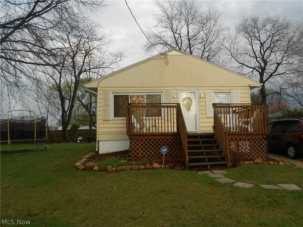 Adorable and affordable! Well maintained 2 bedroom ranch has an open floor plan and partially finished basement. This home offers many updates including newer roof (2006 - tear off), electrical (2013), all newer windows, water line (2014) and full bath. In the master bedroom you'll find a large closet and hardwood floors. There are also hardwood floors under the 2nd bedroom and living room carpets. Located on a quiet street this ranch sits back on the lot and has a nice front and back deck. This property has an extra parcel of land, is in the Ellet school district and is close to shopping and highways. Not a drive by. Home warranty being offered by the sellers for peace of mind.