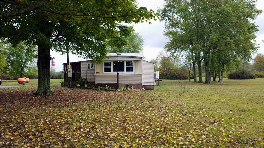 Discover quiet country living at 1440 Porter Rd. Set on a generous 4.15-acre parcel, this manufactured home offers privacy and potential. Whether you're seeking a first-time home, a seasonal retreat, or an investment property, this site provides a canvas for your vision. While the home was constructed in 1973, the foundations of what makes this property special are right here — space, serenity, and room to grow. This property features a two car detached garage and septic newly installed in 2023.. Bring your plans, roll up your sleeves, and transform this property into a dream rural escape.