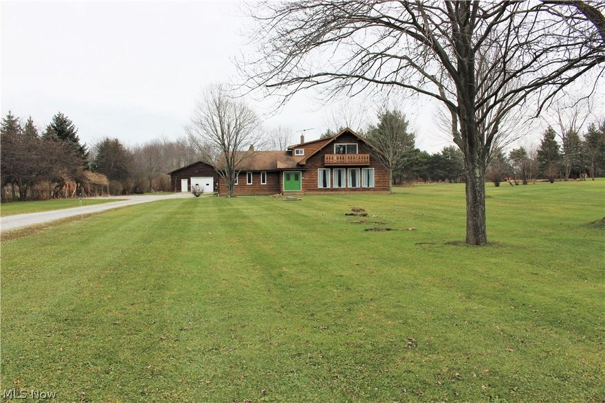 Spacious Rooms!  Situated on 1.65 acres and set well back from the road, this property includes a large outbuilding (60x40) perfect for storing equipment, cars, or workshop.  Many updates have been added to this home, including carpet throughout, removal of wallpaper and painting, heating and AC, kitchen appliances, flooring, and more.  A wall of windows illuminates the spacious living room with newer carpet, and opens to the formal dining room.  Entertain in the sprawling family room with a fireplace that opens through the sliding doors to the patio and private back yard.  The appliances where just installed in the kitchen, with a center island and newly installed floor.  The much desired first floor master suite, includes a full bath.  The second floor has 2 good sized bedrooms and a full bath.  This home is just waiting for your personal touches.