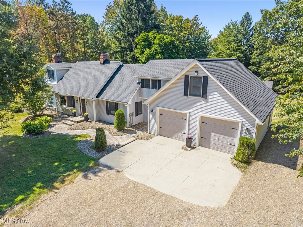 Country living in the city on nearly 2-1/4 acres in Fairlawn! First time offered in 37 years, this gorgeously expanded Cape is set 350 feet off South Miller Road, nestled in a serene setting with trees screening the road for beautiful privacy and seclusion. This remarkable home has been completely transformed and reconfigured over the years. Quality workmanship is evident… from beamed ceilings and timeless crown moldings… to gleaming hardwood flooring… and the built-ins that add so much charm and character throughout. Gourmet Kitchen, the heart of the home, is a show stopper. A sweeping expanse of granite countertops, abundant KraftMaid brand cabinetry and ample task lighting make meal prep a breeze. Kitchen is open to Dining Areas; the warm and welcoming Great Room with lovely, raised hearth, brick fireplace; and the cozy Living Room with full wall, gas fireplace and 8-ft bay window. It’s an extraordinary living space, as comfortable as it is elegant, with plantation oak ceiling – single piece installation, tongue and groove. Other highlights include spacious, 30 x 14 Primary Bedroom with split HVAC, triple closets, generous seating area, and dormer niche with ceiling fan; two 13 x 12 bedrooms; oversized Two-Car Garage with 220 line for electric vehicles; 15 x 12 Mudroom with convenient storage benches; large Deck; inviting Gazebo with electric; Shed with electric; and Lower Level Media Room and Rec Room. Notable recent updates: Furnace (both) (2023); Central Air (both) (2023); Hot Water Tank (2023) Refrigerator (2023), Range (~2021), Roof and Vinyl Siding on House and Shed (2021); Laminate Wood Flooring - Second Floor (2023); Capet in Living Room and Great Room (~2020). Great location includes Fort Island/Griffith's Park, Fort Island Primary Elementary School, and St. Hilary Elementary School as nearby neighbors, along with all the wonderful amenities Northeast Ohio offers! This incredible, move-in ready home is a must-see! Schedule your private showing today!