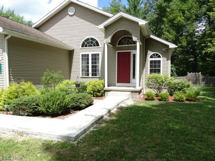 WOW! This is a must see, inside and out. At 2445 Plum Creek in Roaming Shores we have a 1652 Sq. Ft. Ranch home with 3 bedrooms and 3 full baths with a full bsmt on a double .46 acre lot waiting for you. The formal living area is located off the dining area and is separated with a partial wall from the huge kitchen that features all the appliances, ceramic floors, oak cabinets and a pantry. The kitchen is open to the family rm that has patio doors to the rear deck. Perfect for entertaining in all areas! The master suite has plenty of windows and patio doors to the deck with a cathedral ceiling. The master bath has double bowl sinks with a vanity, ceramic tile and a separate toilet area. 2 more bedrooms are on the opposite side of the home with a main bath between. The basement has a 3rd full bath and ready to be finished as a great rm or theatre rm if needed. Fall in love with the very private yard that is fenced in and the additional wooded lot.