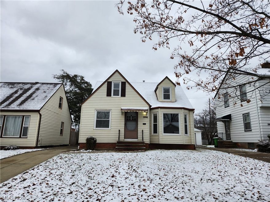 Don't miss out on this quaint, cape cod! Tile flooring in the kitchen, hardwood throughout the first and second floor. Two bedrooms and a full bath on the first floor, with a large third bedroom upstairs. Spacious living room that leads into the dining room and kitchen. Partially finished basement was recently updated with LVT. Laundry room with storage on one side and a built-in bar with extra living space on the other. Great rental income potential!