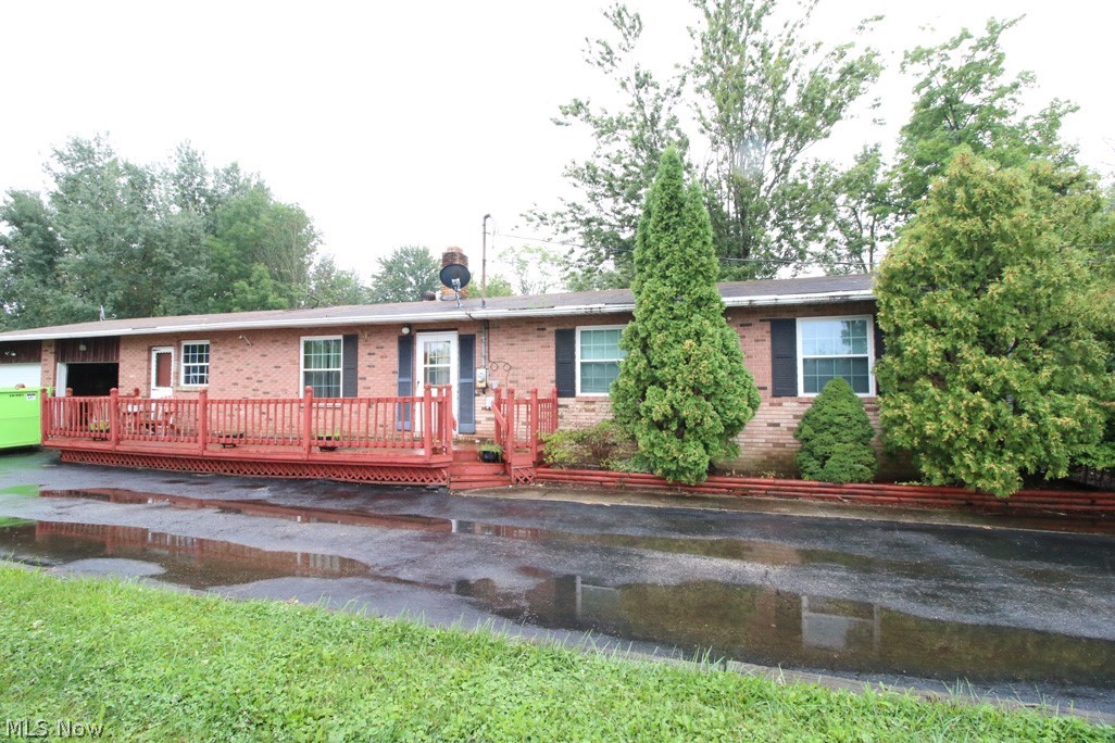 Home being sold As-Is. Brick and aluminum sided ranch located on 2.09 acres. Large backyard as well as treed area. This is not a modular home or mobile home. This home was built on a crawl space. Oversized 2 car attached garage. Rec Room addition on the back of the home. Family room located between the garage and the home. Wood burning fireplace in the living room. Spacious kitchen with electric cooktop, double wall oven, dishwasher and built-in microwave. 2 full baths. Large deck on the front of the home and a patio in the rear of the home. Storage shed is in the backyard.