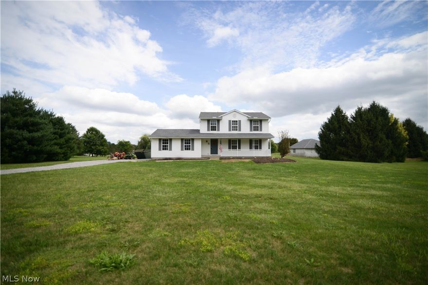 Hard to find 3 bedroom, 1 1/2 bath home, in South Range School District, on 5 beautiful acres of land! The spacious oak kitchen, both bathrooms, & office have brand new, luxury click-lock "wood look" vinyl flooring.  New frieze carpeting, in the large living room, on staircase, and down upstairs hallway. All lighting fixtures just updated. Entire 1st & 2nd floors freshly painted, in modern neutrals. Huge master bedroom with walk-in closet and access to main bath. Very roomy secondary bedrooms. Newer Gordon Brothers water conditioning system. Furnace blower motor replaced, in 2018. Exterior lighting fixtures replaced, on home. 2 car attached garage. Enjoy the view from the big, covered front porch. Got horses? 3 acres are fenced in pasture that include two run-ins, for shade. 5 stall horse barn. No horses? The barn would make a great storage shed. Shutters and front door just painted in colors perfectly suited to a "farmhouse." Rural perfection!