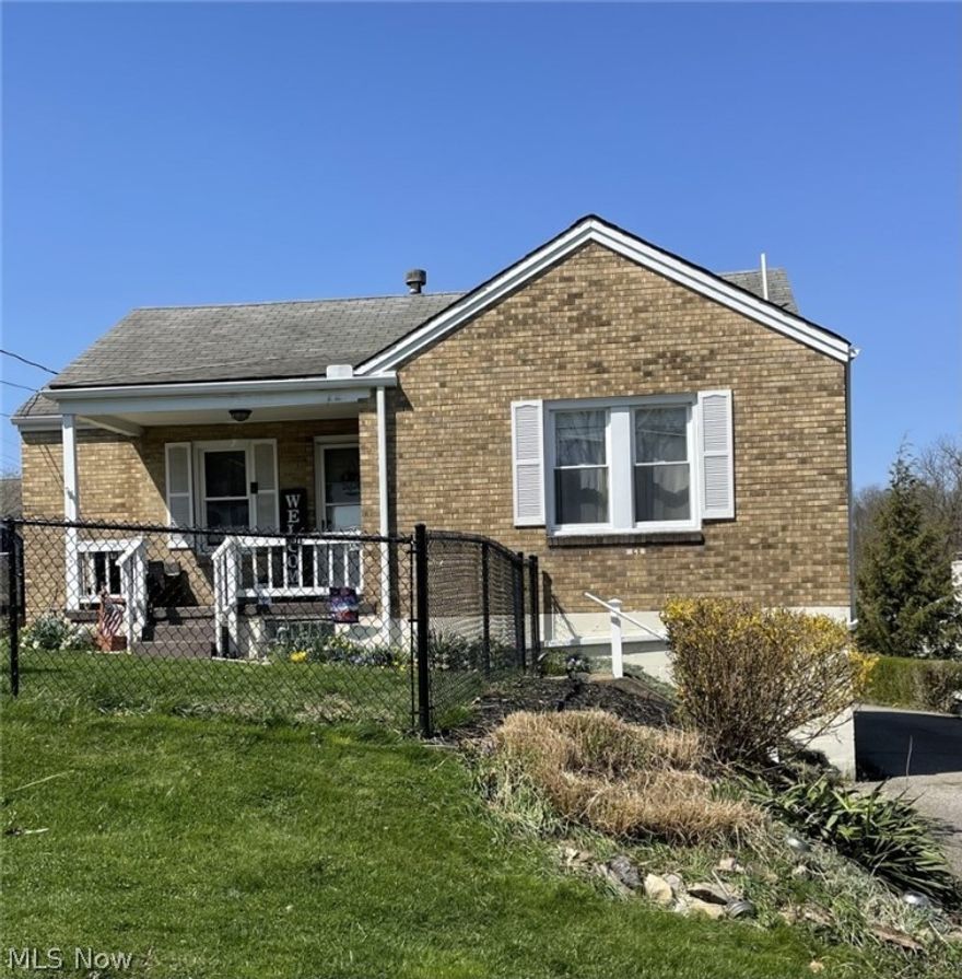 Spring on the chance to own this adorable two bedroom, spacious, brick ranch with a cute front porch.  This home features a comfortable livingroom, roomy eat-in-kitchen boasts built in corner hutch/pantry and updated vinyl accent wall, New furnace, New fencing and fresh paint throughout.  The lower level offers additional space that could be designed as third bedroom or a familyroom/rec room.  Don't wait, Call today!