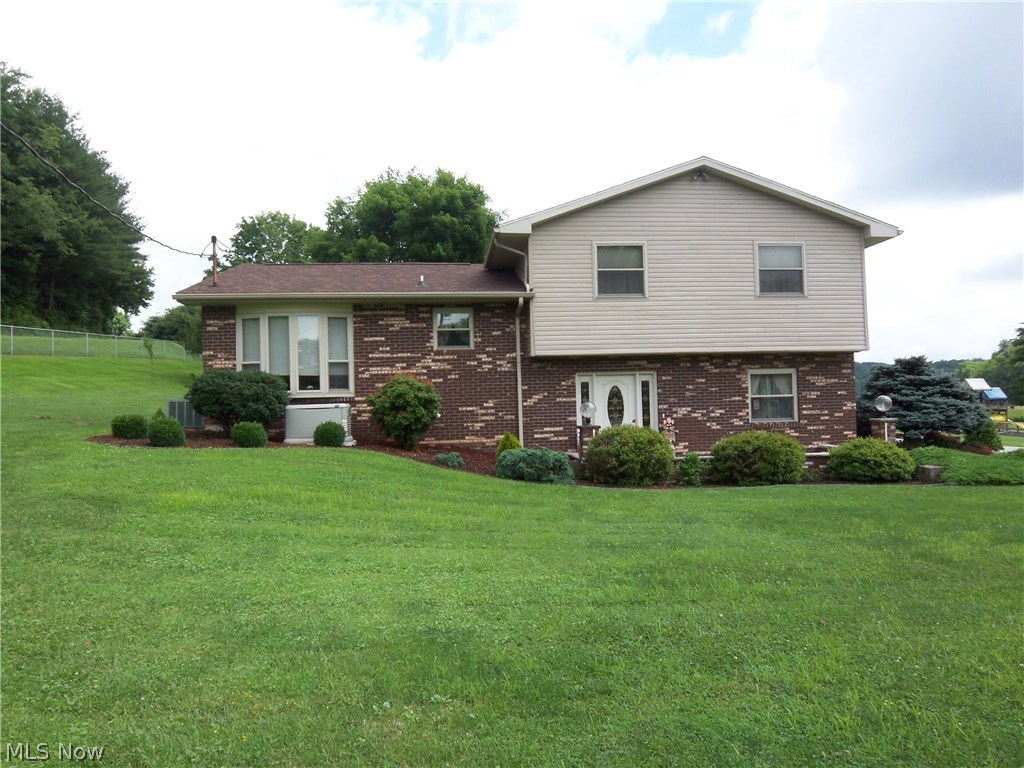 Unique quad-level home with an open floor plan. Kitchen and baths have been updated. The roof on house and workshop replaced in May 2018, installed whole house back-up generator in 2017, new Pergo floors in living room, family room and bath in 2017. Appliances are six months old plus two new garage doors, rails and openers 3 months ago.