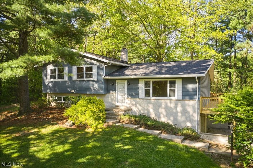 Situated on a beautiful 1.425 acre wooded cul-de-sac lot, this home features 1832 square feet with many nice updates! The hardwood floors are in beautiful shape and run throughout the living room, dining room, stair cases, and all three bedrooms. The original woodwork throughout the home is in impeccable shape. In the lower level of the split you'll find the family room with a beautiful white brick wood burning fireplace. There are two full baths and a nicely sized dining room. The sellers have made the following updates in the last month: new roof, new wrap around deck, new furnace, new garage doors and openers and replaced the brick wing walls next to garage doors. The remainder of the updates are ready for the new buyer to make this home their own. There are two sheds on the property. The septic and well have already been inspected for the buyer's convenience.