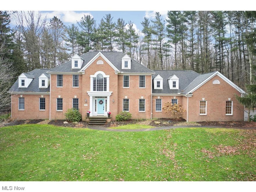 Nestled on over 2 acres, this captivating 4-bedroom, 4.5-bath Colonial home is located within the award-winning Revere School district. Boasting a first-floor owner's suite, this residence is thoughtfully designed to cater to modern living. The heart of this home is its new kitchen, a chef's delight that seamlessly combines style and functionality. The kitchen features quartz counters, SS appliances, and a wet bar, and opens up to the Great Room w/ a wall of windows & cozy fireplace. Kitchen also includes access to the large, Trex deck & backyard w/screened-in gazebo. Perfect for entertaining inside & out! Formal Dining Room, living room, study, mud room, laundry room & half bath complete the main level. 2nd floor features 3 bedrooms (extra master suite) & 2 full baths. With over 2,300 finished sq ft in the lower level, it features rec room, office, 2 bedrooms, 1 full bath, workout room, & more. Recent upgrades, include 2 new hot water tanks installed in 2020, and new furnaces, updated in 2018 and 2019, new mud room & new laundry room. 4-car garage & extra parking pad. Great highway access to I-77, I-271, and I-80, as well as Olessia's, Whitey's and more! Schedule your showing today!