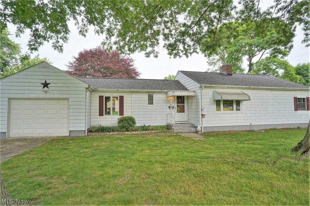 Cute, updated 2-bedroom Ranch on double lot. Large, fireplaced living room with hardwood floors and rounded doorways, has large picture windows on front and back walls for lots of natural lighting and built-in bookcase, leads to updated, applianced kitchen, complete with Barker cabinets, Wilson Art counters, subway tile backsplash, ceramic flooring, recessed lighting, and pantry with pull-out drawers. Breeze way has been converted to formal dining room with hardwood floor, sliders to new back steps and backyard. Dining room also has entry to attached 1-car garage for easy grocery unloading out of the weather! Other end of the house has two nice sized bedrooms with hardwood floors, one with two double closets. There's also a full, updated bath including new vanity with Corian counter, Kohler deep soaker tub and ceramic floor. Lower level has woodburning fireplace waiting to be part of finished rec room, with several storage closets and laundry area. Corner/double lot gives you .27
