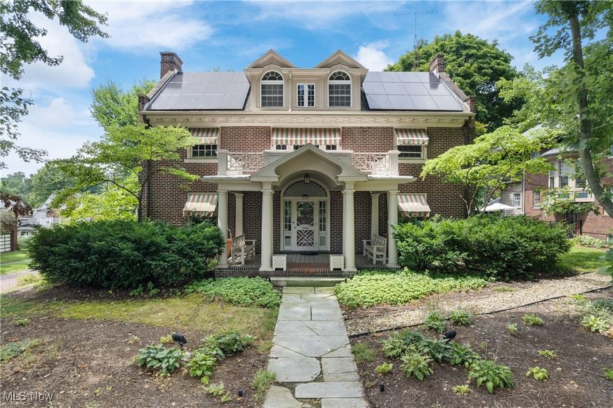 Step into one of Wooster’s most amazing homes—an exquisitely preserved 1915 Georgian-style estate offering nearly 6,000 sq ft of finished living space, where historic grandeur meets modern versatility. Zoned for residential and home-based business use, this registered historic landmark features a gourmet chef’s kitchen (2010 Ivan Weaver addition) with Wolf/Subzero appliances, granite counters, dual dishwashers and ovens, wine fridge, prep zones, and a butler’s pantry. Multiple living areas include a grand foyer, formal living and dining rooms (original chandelier, dining set, and chinaware included), sunroom, family room, rec room, and office spaces. The second floor boasts an owner’s suite with walk-in closet, sitting room, balcony, and Jack-and-Jill bath, plus three additional bedrooms—one currently a laundry/hobby room with drying cabinet. A finished third floor offers a large bedroom, cedar closet, and storage. The home can be used as a 5-bedroom, though one is set up as a laundry room, accounting for the difference from the auditor’s site. The walk-out lower level offers incredible versatility: a finished basement or a home-based business space with separate entrance, address, lobby, offices, and conference room. Originally a yarn shop in the early 1900s, it later served as a law office. Accessibility features include an elevator servicing three levels, ramped patio, and accessible bath. Outside, enjoy a manicured oasis with stamped concrete patio, outdoor kitchen, fountain, greenhouse, screened gazebo, garden beds, stunning landscaping, and utility shed. Mechanical upgrades: new boiler (2023), whole-house generator, solar panels, modernized plumbing/electrical, many windows, and more. Built by the Rhodes family (Wooster Brush Co. founders) and lovingly preserved by the Broehl family since 1983, this is a rare opportunity to live, work, and entertain in timeless style. You’ve got to see it for yourself!