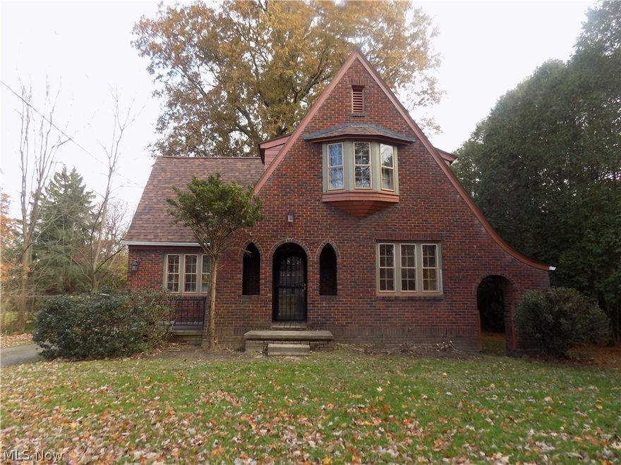 Brick Tudor home with 4 bedrooms and 3 full baths. Vaulted living room with fireplace, family room, formal dining room.  Property sold as is. No guarantees. No warranties.