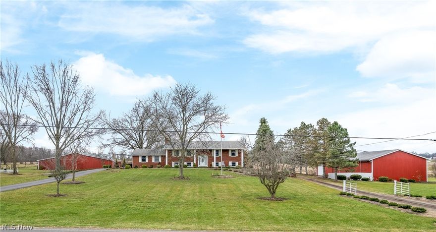 Check out this amazing 4 bedroom 3 full bath all brick home with over 3100 sq. ft. of space. It has been well maintained by the original owner and has unique features not typically seen, so pay attention to detail. Located on 7.21 acres in Marlboro Twp. in the highly desirable Marlington Local School District. The lot has 894 feet of frontage for a possible split to build a second home, farm or just room to roam. As soon as you pull in the driveway you will notice the two large outbuildings. One building has a separate driveway and is 40x120 with concrete floors, 3 high separate doors and 1/3 of the building has heat. Was built in 1994. The second barn is 32x82 which is great for storage and has 2 horse stalls inside. Upper level features a large 23x13 eat-in kitchen with all appliances included. There is a slider off kitchen leading to the back maintenance free trex style deck with beautiful views of the lot and surrounding rolling fields. Down the hall is a master bedroom with full master bath, two more bedrooms and another full bath. There is also a 24x15 living room. Main level features a 23x17 family room leading to a side foyer with brick floor and a first floor office. Lower level offers more space with a possible 4th bedroom, full bath and a large laundry room with washer and dryer included. The 29x23 rec room completed the lower level and features a wet bar, brick fireplace, and a walkout lower level to a covered back patio. Updated roof, vinyl windows, and new softener in 2025. This one has it all and then some, and with some personal touches will make a great house to call HOME!