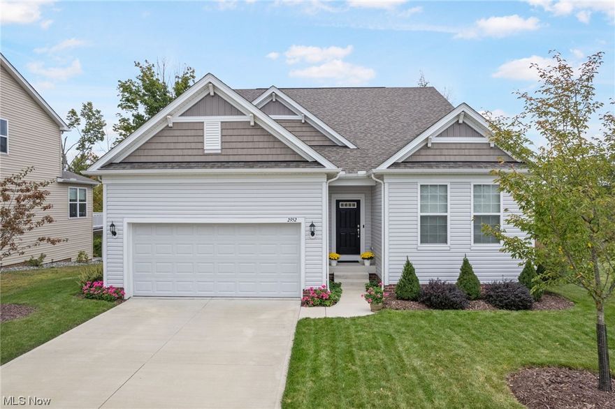 Welcome home to this exquisite like new home! Enter into the bright open-concept main floor. Relax in the living room by the cozy fireplace or unwind in the sunroom leading to a delightful deck - perfect for enjoying the scenery or entertaining guests. The main living area showcases stainless steel appliances, an extra-large island with stone countertops, and convenient pantry, a dream for any culinary enthusiast. Additionally, the first-floor laundry with large adjacent flex-room adds to the convenience. The main floor boasts an office, two bedrooms with full bathrooms including the luxurious first floor primary suite with a walk-in closet and a spacious bathroom featuring double sinks, offering comfort and style. The second floor features another bedroom, a full bathroom, and a huge loft area, providing flexibility and privacy. The finished walk-out basement has a large light-filled bedroom and is already plumbed for a full bathroom and kitchenette, offering endless possibilities for customization; a perfect teen or in-law suite. Step out to the patio to enjoy the beautifully landscaped surroundings. A variety of added trees, and a wooded view create a tranquil atmosphere. The extra-deep finished garage, equipped with a smart garage door opener, offers convenience and functionality. Set in a close-knit community filled with activities, this home offers not just a residence but a lifestyle. Don't miss out on the chance to make this your haven!
