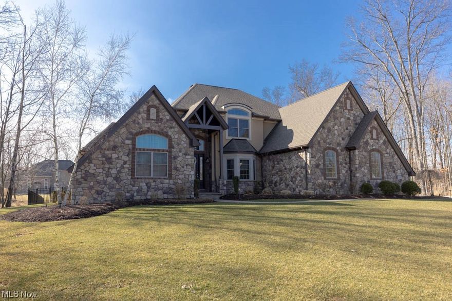 Get ready to be impressed by this beautiful, exclusive 4 bedroom, Colabianchi Custom built home, located the highly sought after Cedar Creek Estates of Strongsville. As you enter through the grand foyer, you will notice the open floor plan, leading you into the spacious dining & Great room. The great room offers high ceilings, beautiful natural, lighting, and a fireplace with a beautiful mantle.  Enjoy cooking gourmet meals in this updated, modern kitchen w/ pendant lighting, breakfast bar and nook which is a perfect place to to host family gatherings. Included are, stainless steel appliances, granite counter tops, beautiful hardwood floors and plenty of cabinet space!  First floor offers a spacious laundry, mud room, bath and office room. The first floor master bedroom is spacious w/ a large walk in closet, and master bath.  Unwind and relax in the jaccuzzi tub after a long day.  Three large extra bedrooms & bath are just down the hall for family members or houseguests.  Entertain your guests in the open recreational lower level area that includes a wet bar with granite countertops, pendant lighting, ceramic backsplash & ample room for seating. Pick out a vintage bottle of wine from the attached wine cellar. Enjoy summer nights by your covered, cement patio overlooking the heated pool.  This home is also smart time & can be controlled at your fingertips.  Schedule a private showing today, to witness it’s Beauty in person. A 1year home warranty is offered for peace of mind.