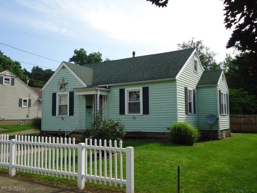 Tastefully redone. Very neat and clean. Nice floor plan. Replacement windows/vinyl siding. Spacious rooms. Updated paint colors. Formal dining room, hardwood floors. Large living room. Updated carpet. Bright, cheery kitchen overlooks private back yard and covered patio. Large bedroom. Updated bath with walk-in shower, newer vanity and ceramic tile floors. Sunroom off kitchen. 1.5-car garage plus additional storage shed. Alley bound, treed lot with 4 extra parking spaces behind garage. Very convenient. 1 minute to Rt. 36 & I-77. Sale is subject to seller getting suitable housing.