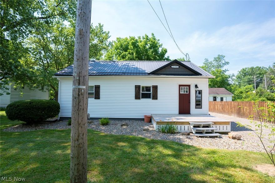 Welcome to this updated Ranch in the Grove! Enter through the front door to find a foyer with new hardwood floors and cozy living room. Freshly painted throughout. The eat-in kitchen has white cabinets, stainless steel countertops, stainless steel appliances and hardwood floors. Leading off the kitchen is a sliding door to the patio, which is perfect for entertaining and grilling out! You'll also find the laundry room with new flooring and built-in bench off of the kitchen. The first floor contains three bedrooms and full bathroom. Outside, you'll find a large, detached garage/outbuilding. The garage offers 220 amp service, which is perfect for a workshop space! The two-car garage/building is divided in the middle and is great for storage! Firepit in backyard is wonderful for relaxing and hanging out. Many updates include, but not limited to: Roof/Siding on house and garage (2018), Furnace and Central Air (2019), Garage door (2018), service doors (2018), Flooring (2018), Updated bathro