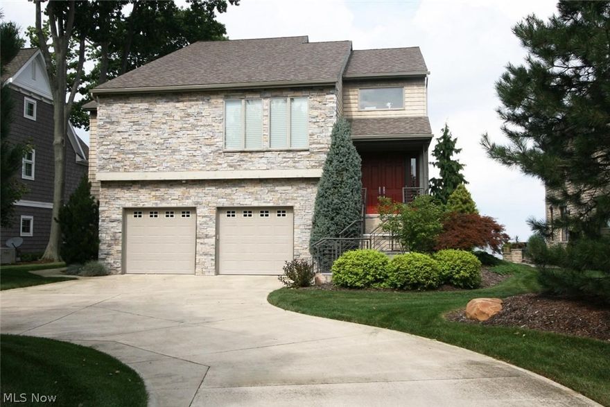 Lake Erie waterfront home. Incredible panoramic views. Everything is custom designed to perfection. Private street with beautiful sandy beach. Food enthusiasts, don't miss this well-planned kitchen including granite counter tops, high-end stainless appliances featuring a SubZero fridge & Wolf 36 French cooktop range. Espresso coffee bar, wine fridge with 160 bottle capacity. Walk-in pantry. Imported Italian tile flooring. Designer lighting & window coverings. Bose surround sound. Exquisite master suite! Bath has glass tile, California closets. 4 bedroom suites, 2 fireplaces. Fantastic storage. Walk-in wine cellar. 3 car garage. Whole house generator. 2 furnaces, 2 C/A systems. Room sizes, sq. ft. and dates are approximate.