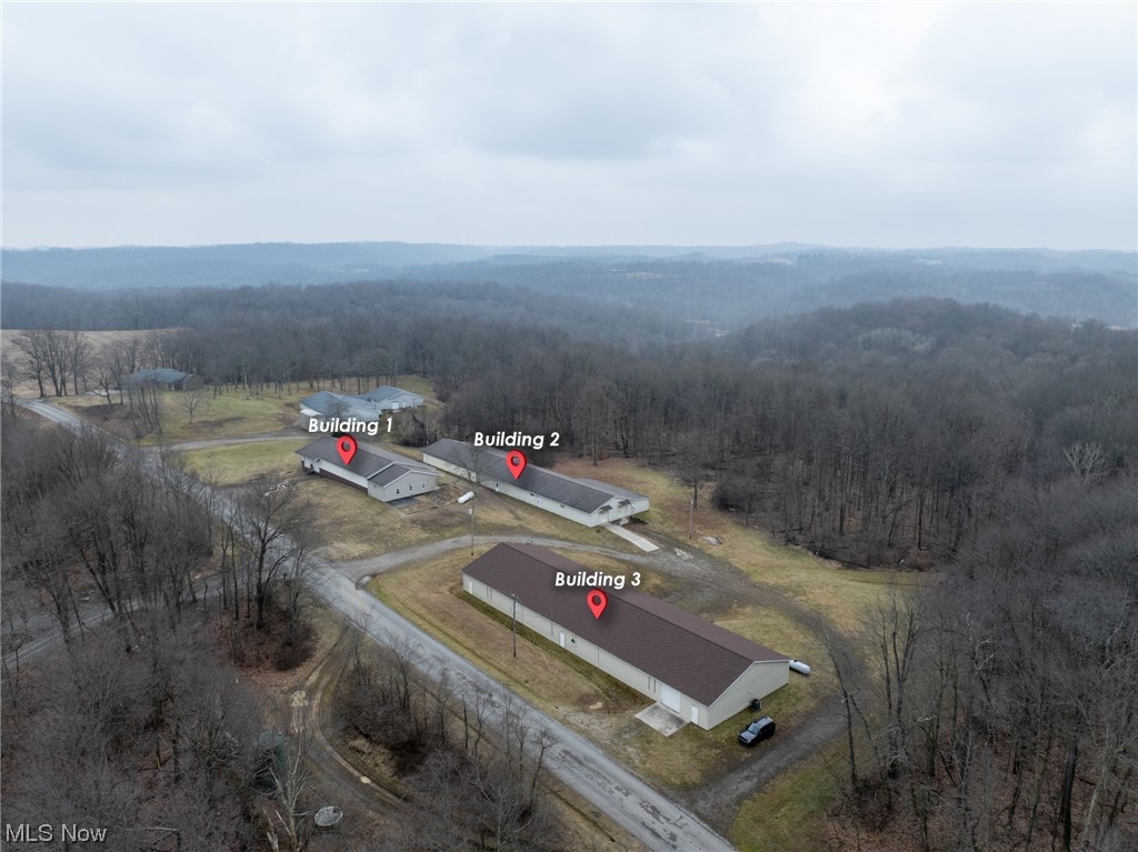 Auction 3/14/24 ending 6:00 PM - PARCEL 2: 1.5 Acres w/ 212’ frontage. Includes Building 3. - Discover a well-maintained commercial property spanning 8.2 acres, featuring three buildings totaling over 22,000 square feet of adaptable space. Building 1 comes to 6000+ sqft with an office area and restroom separated from a large open space area with two overhead doors and storage room. Building 2 has 8,000+ sqft of open, multi-use area. Two overhead doors and a dock at each end accompany this building. Building 3 gives another 8,000 sqft of open area, with double garage doors and docks on the back side and a front garage door that can be driven into. Lot is well graveled and able to handle trucks with access to SR 39. Buildings 1 and 2 have 3-phase electric, propane gas heat, and all have had new roofs recently installed. This flexible property provides room for growing business, excellent investment, or country building site. Make plans to attend the preview and bid on this auction.